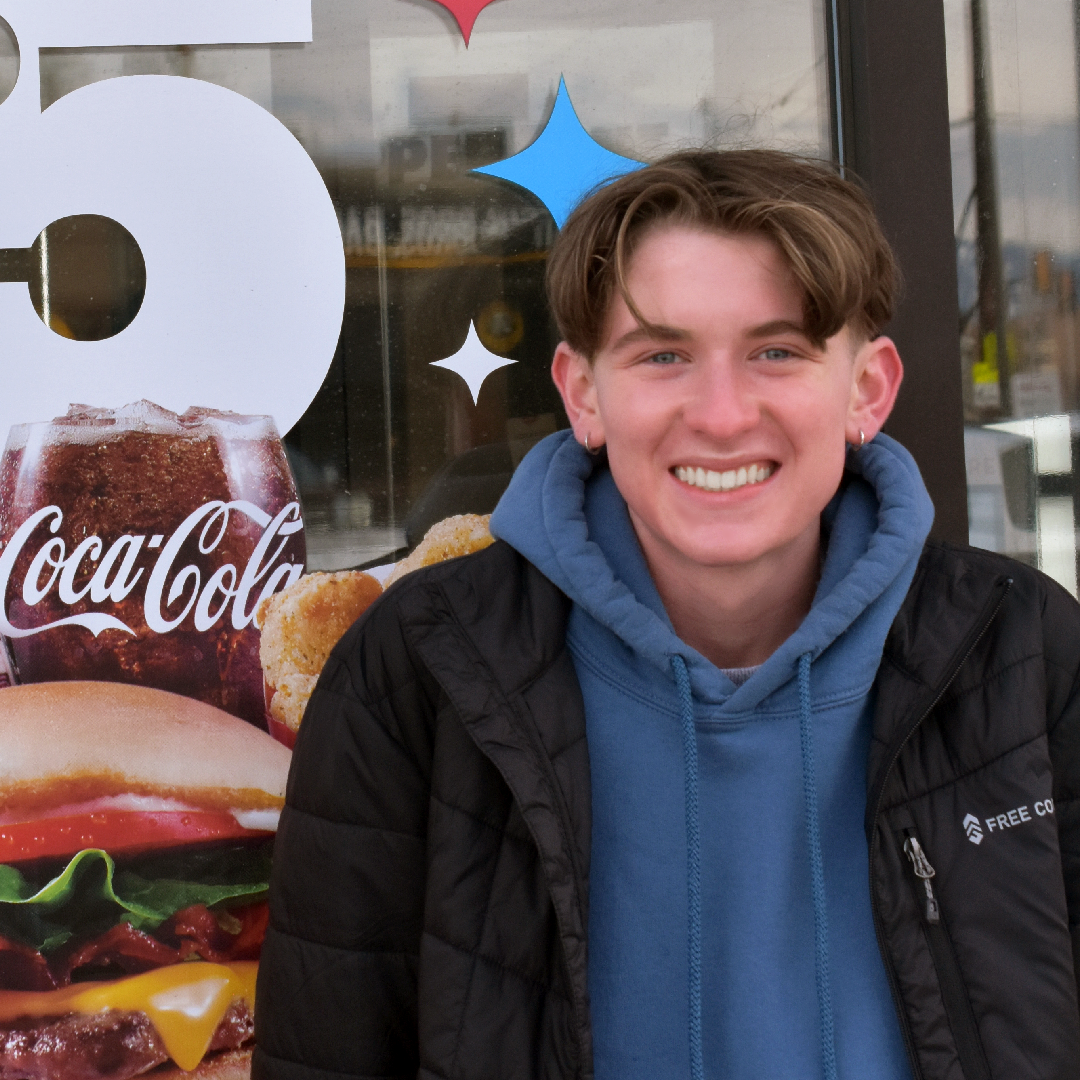 Photo of Elan in front of Wendy's